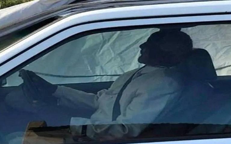Funeral of Leader in a Luxury Car sitting on Driving Seat